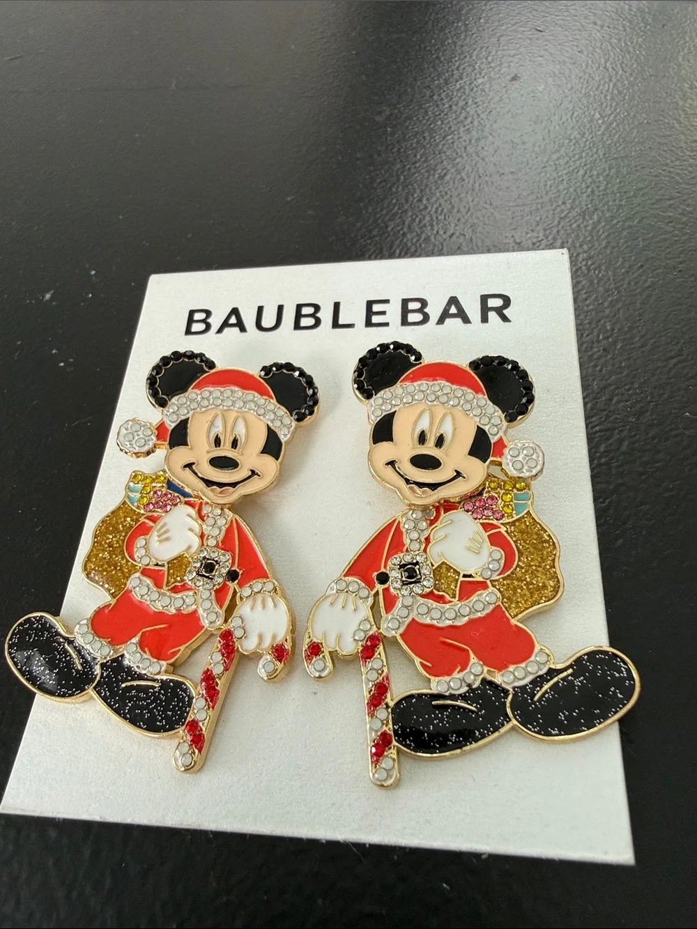 NEW BaubleBar Disney holiday earrings feature a sparkling Santa Mickey Mouse